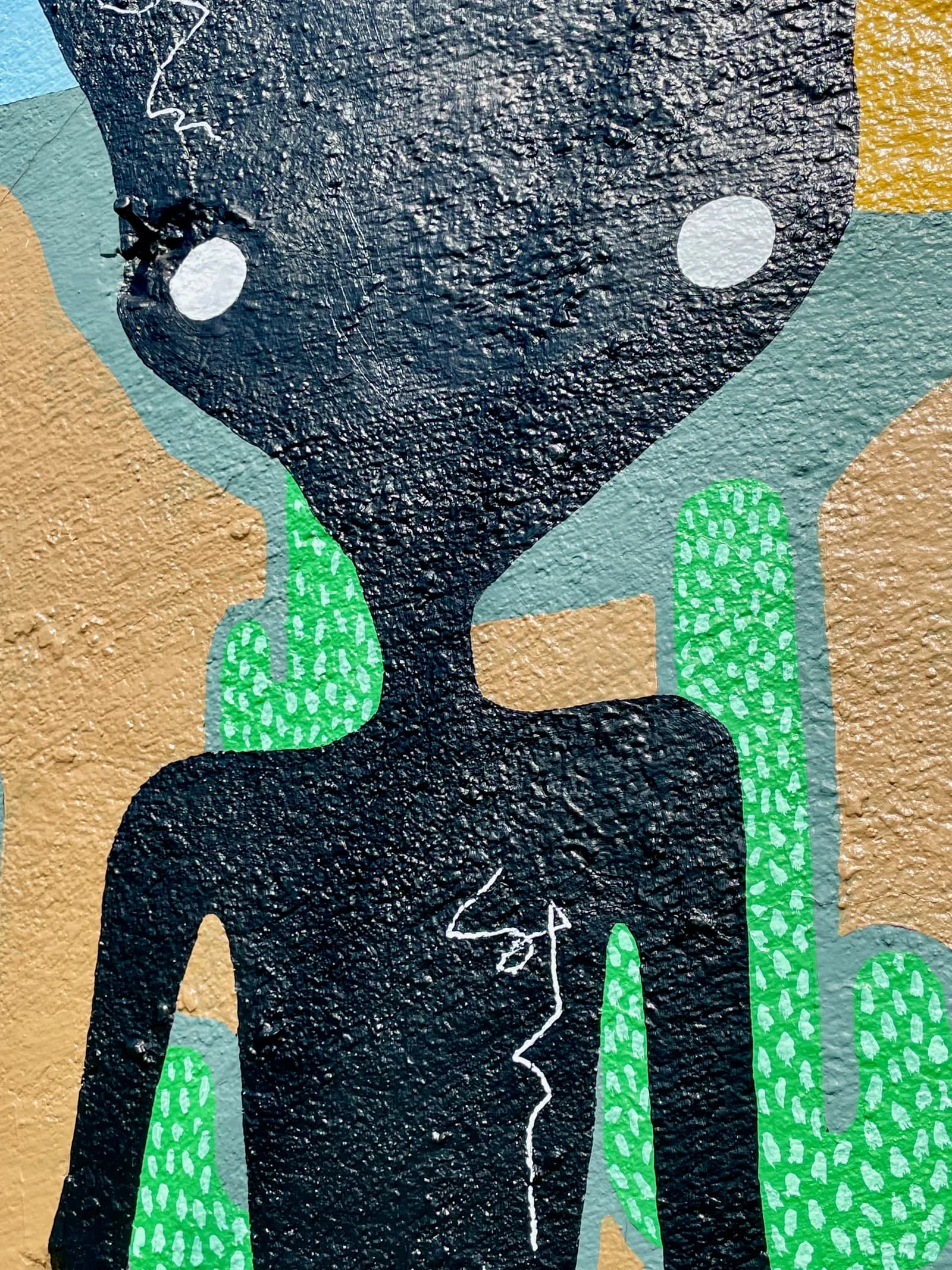 Close-up of a silhouetted figure in the “Never Stop Searchin'” mural, with white eyes and fine scribbled linework